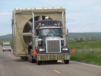 Central Montana... blue skies, green pastures, the mountains gone and the traffic very low... except a few heavily loaded trucks avoiding Interstate 90 (about 40 miles south of Highway 12).